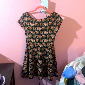 size large, black dress with red and green rose pattern, criss cross back